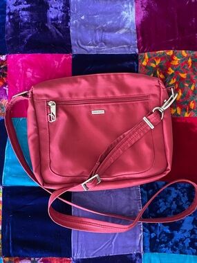 Travelon Nylon Red Crossbody Anti-theft Bag. RFID blocking, zipper tag locks
